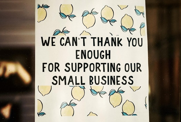 A picture of a sign thanking customers for supporting their small business.